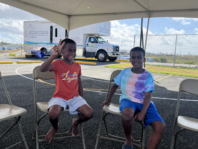 kids waving to the camera